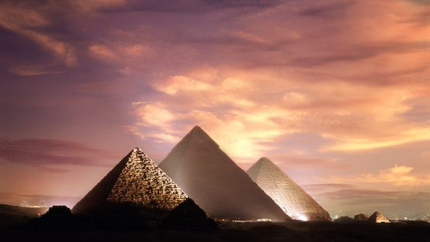 The Pyramids at Giza illuminated at dusk.