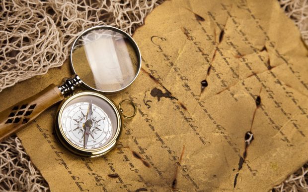Compass letter magnifying glass.