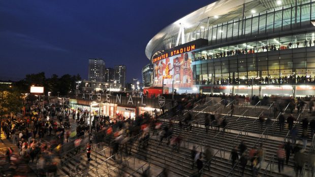 Emirates Stadium at night.