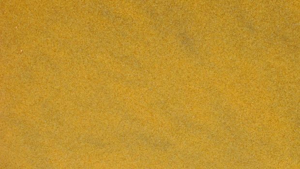 Gold wallpaper with sand.
