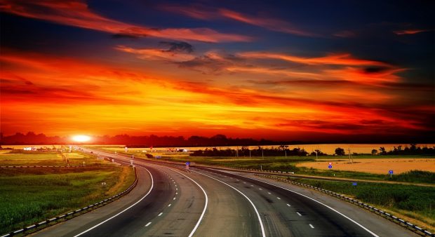 Highway at sunset wallpaper.