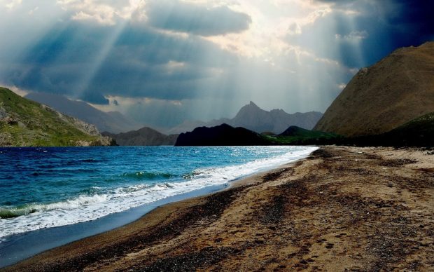 Sunbeams on a lovely sea cove beach hd wallpaper 1920x1200.