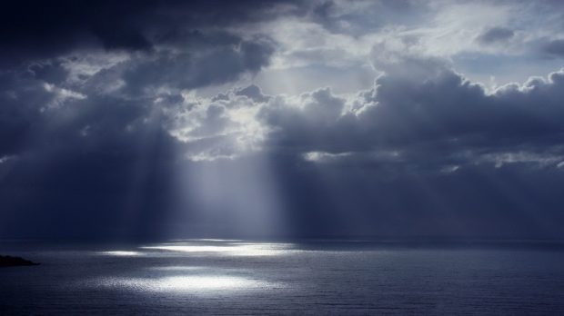 Sunlight through dark clouds wallpaper hd.