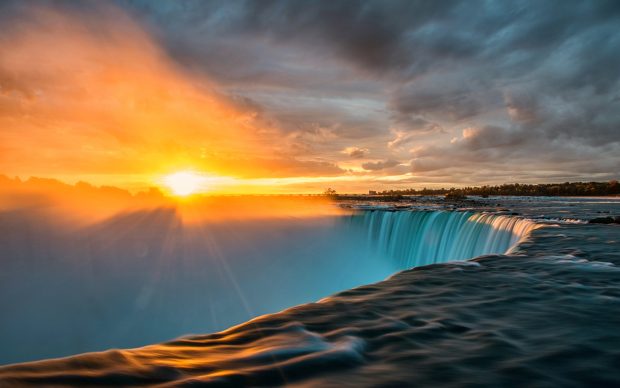 Sunset Over the Waterfall Wallpaper.