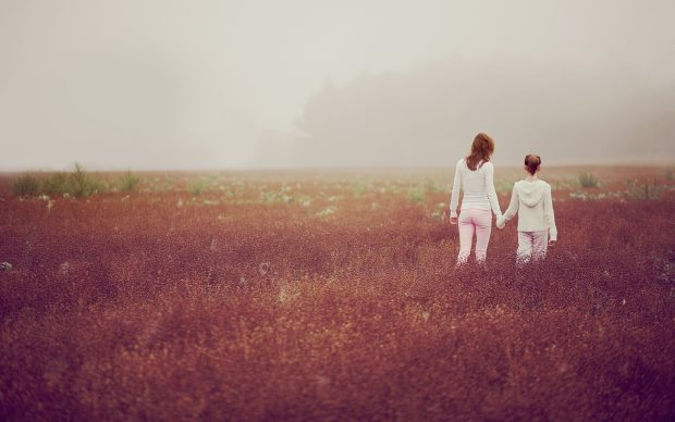 Wallpaper mother and daughter walking in nature.