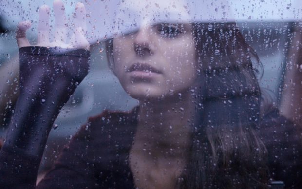 Cute Girl Rain Window Background.