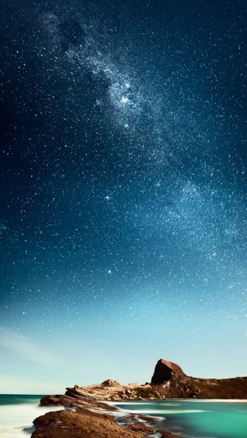 Shiny Milky Outer Space Over Sea iPhone Wallpaper.
