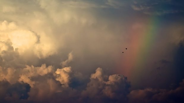 Storm Clouds And Rainbow iMac Background.