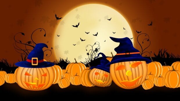 Spooky Halloween night scene featuring glowing pumpkins with witch hats, flying bats, and a full moon in a dark sky, perfect for Halloween decorations and festivities.