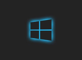 Windows logo 11 illuminated with a blue glow on a dark background.