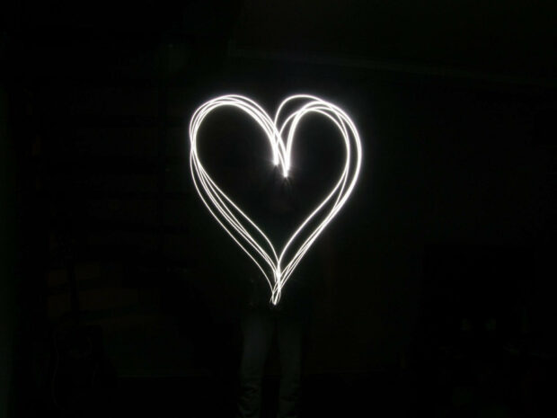 Glowing White Heart Aesthetic Wallpaper.