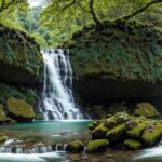 4K wallpaper of a majestic waterfall framed by lush greenery in the summer