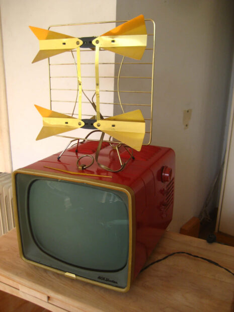 A Modern Flat Screen Television With Multi colored Background.