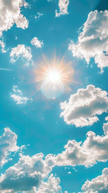 A simple yet cheerful image of a bright yellow sun against a clear blue sky with fluffy white clouds.