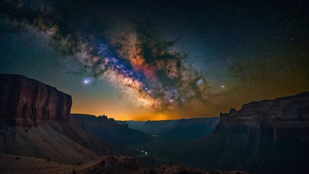 Breathtaking summer night canyon wallpaper with the Milky Way arching overhead.